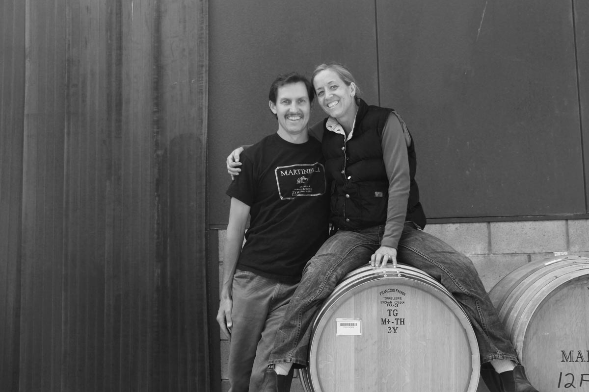 Emma and Jesse with wine barrels black and white photo